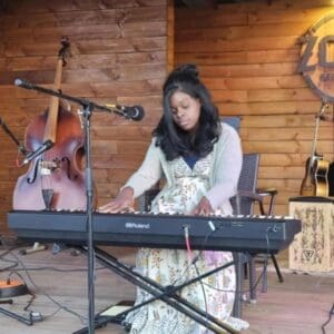 local musician joyceann maynard plays her keyboard during a live show